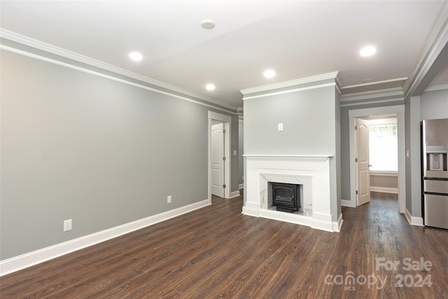 unfurnished living room featuring dark wood-type flooring and crown molding