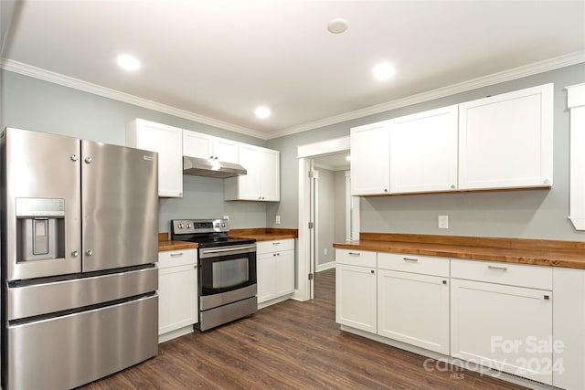 kitchen with dark wood-type flooring, white cabinets, ornamental molding, wood counters, and appliances with stainless steel finishes