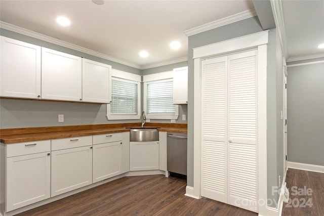 kitchen with butcher block counters, white cabinets, and dishwasher