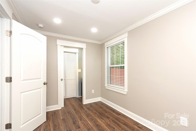 interior space featuring dark wood-type flooring and ornamental molding