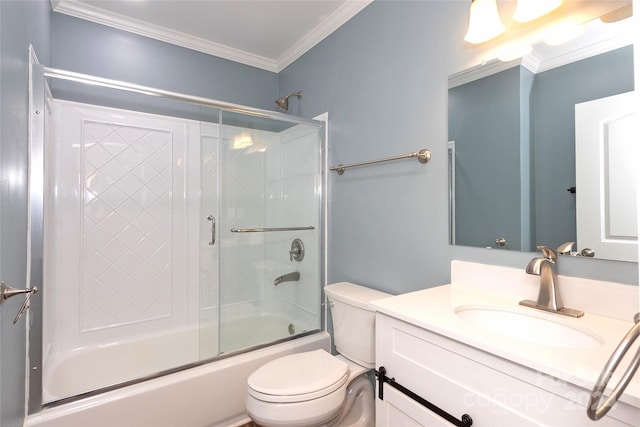 full bathroom with vanity, combined bath / shower with glass door, crown molding, and toilet