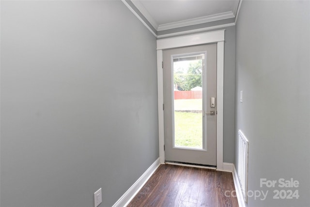 doorway featuring dark wood-type flooring and ornamental molding