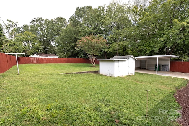 view of yard featuring a shed and a carport