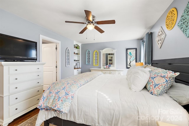 bedroom with ceiling fan and hardwood / wood-style floors