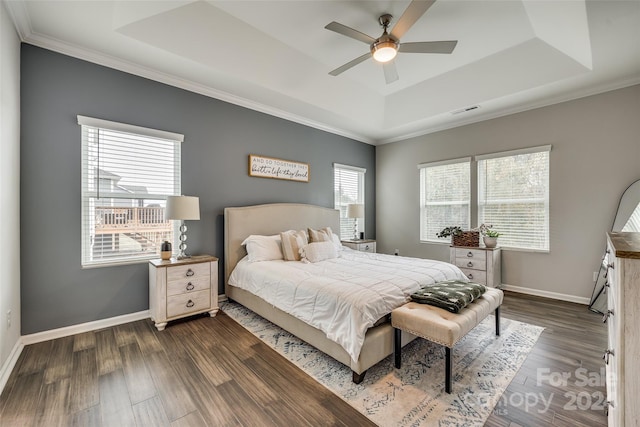 bedroom with dark hardwood / wood-style flooring, multiple windows, and ceiling fan