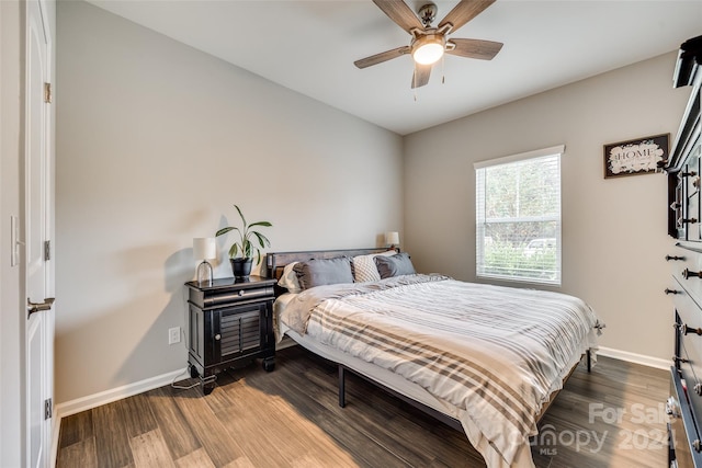 bedroom featuring ceiling fan and dark hardwood / wood-style floors