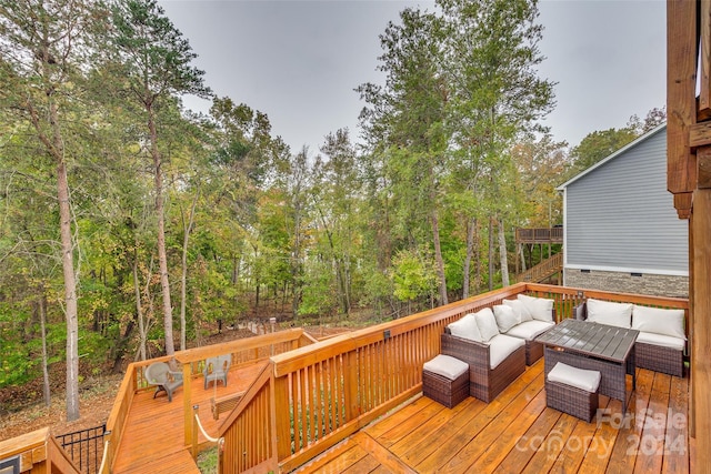 wooden deck with an outdoor hangout area