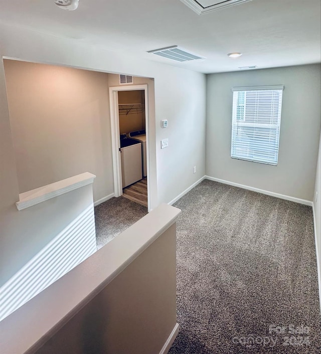 unfurnished room featuring carpet flooring