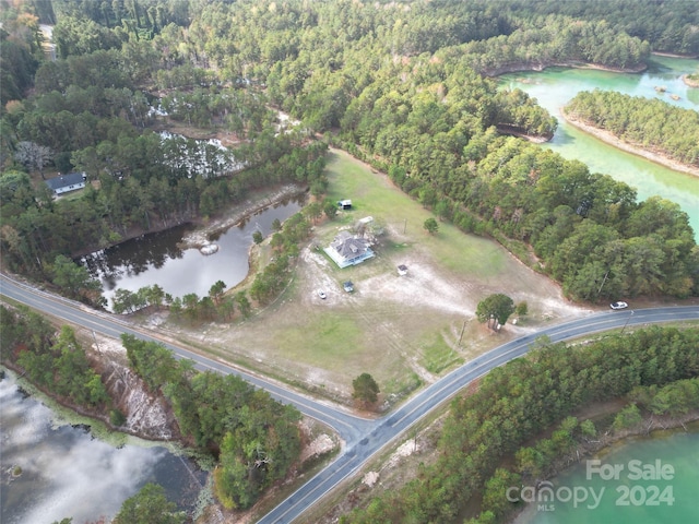 2034 Haileys Ferry Rd, Lilesville, NC 28091 - aerial view of property and surrounding area featuring a forest and a nearby body of water