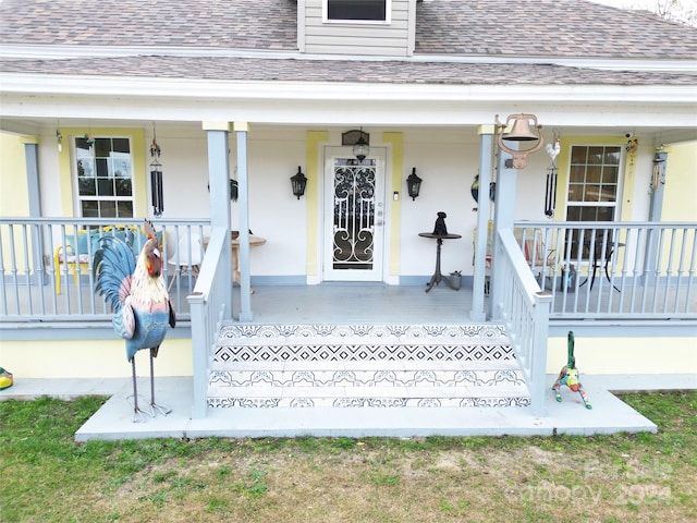 view of exterior entry featuring a porch