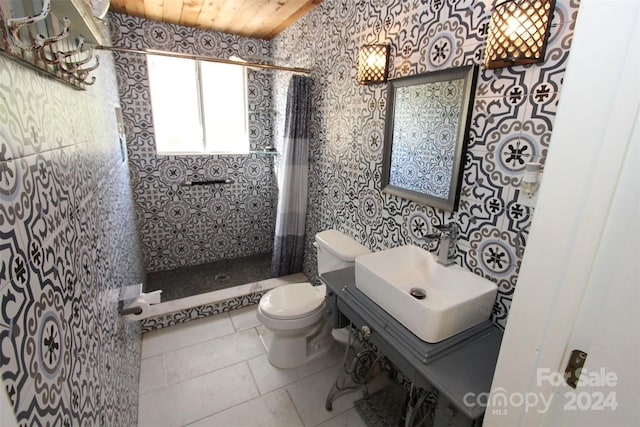 bathroom with sink, a shower, wooden ceiling, tile patterned flooring, and toilet