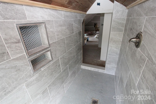 bathroom with tiled shower