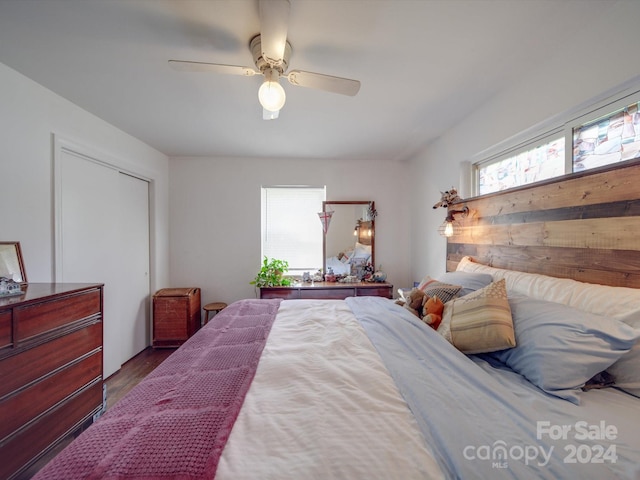 bedroom with ceiling fan and hardwood / wood-style floors