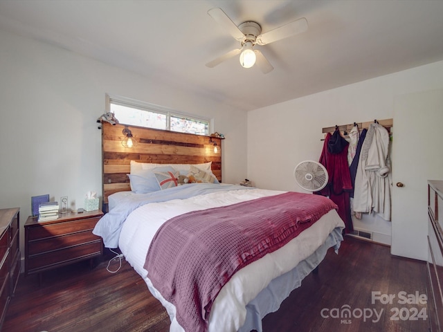 bedroom featuring ceiling fan and dark hardwood / wood-style flooring