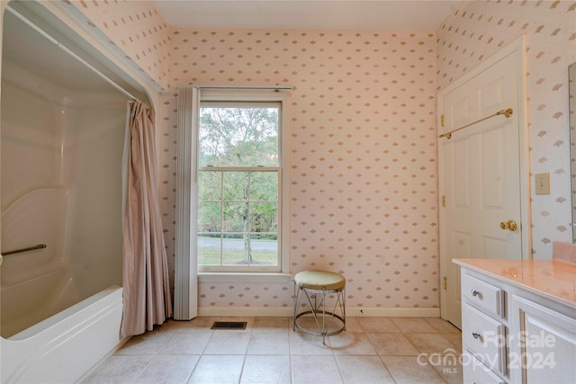 bathroom featuring vanity, tile patterned floors, and shower / bathtub combination with curtain