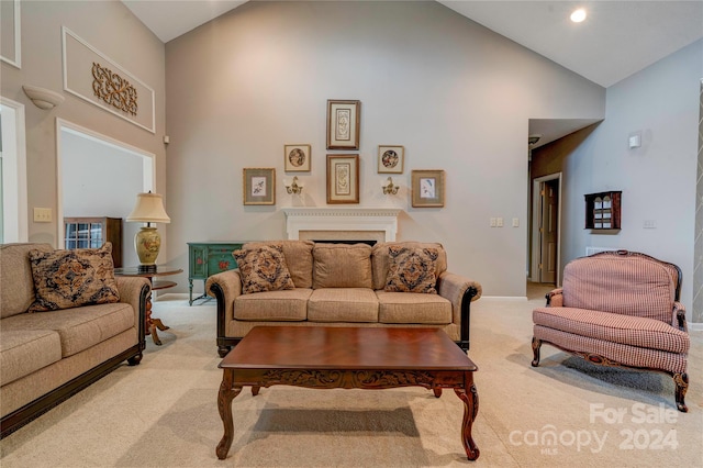 living room featuring high vaulted ceiling and light colored carpet