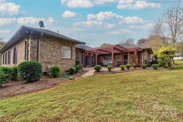 exterior space with a patio area, a pergola, and a front yard