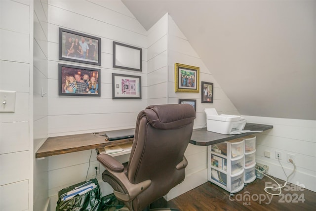 office featuring vaulted ceiling and dark wood-type flooring