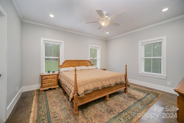 bedroom with multiple windows, ceiling fan, and dark hardwood / wood-style floors