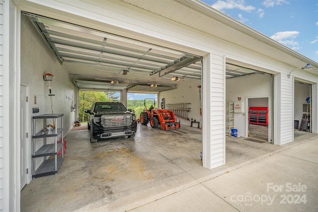 garage featuring a carport