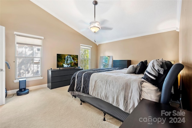 carpeted bedroom featuring ornamental molding, lofted ceiling, and ceiling fan