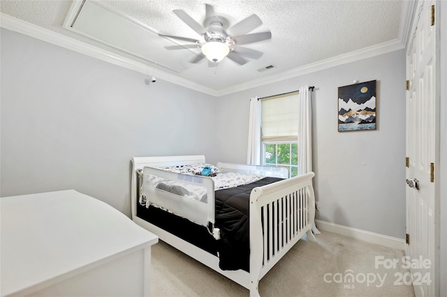 bedroom featuring a textured ceiling, light carpet, ceiling fan, and crown molding