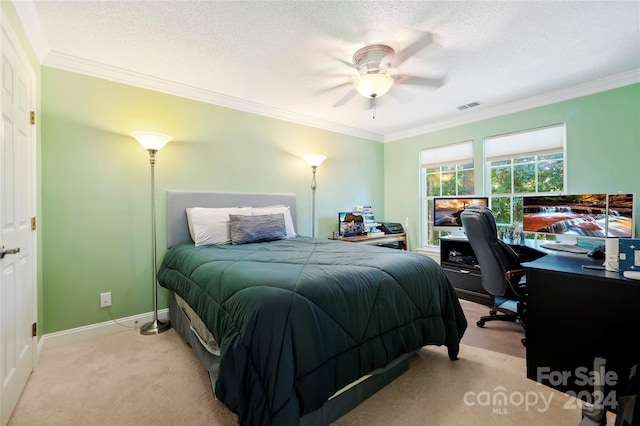 carpeted bedroom with ceiling fan, a textured ceiling, and crown molding