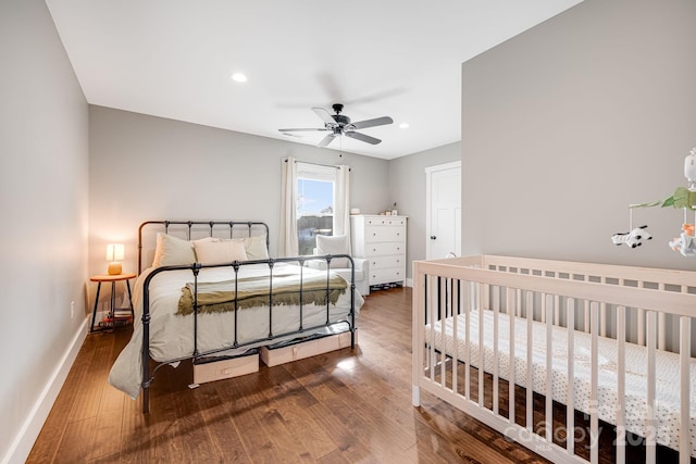 bedroom with ceiling fan and hardwood / wood-style floors