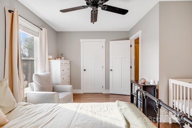 bedroom featuring wood-type flooring and ceiling fan