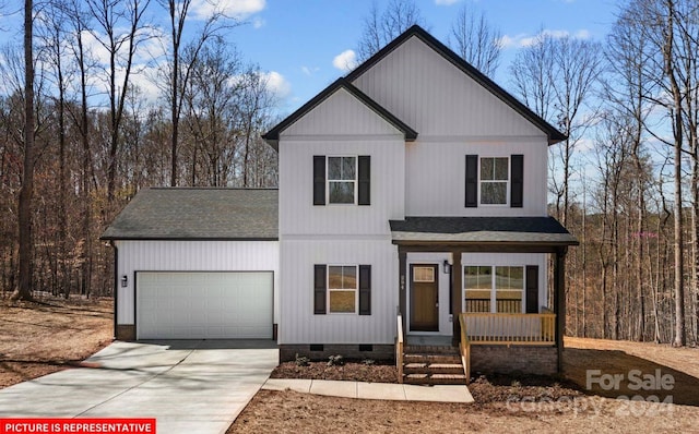 view of front of property with a garage and a porch