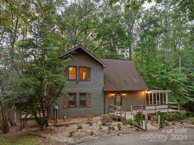 view of side of property with a sunroom