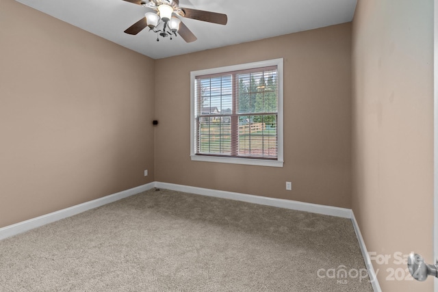 unfurnished room featuring carpet and ceiling fan