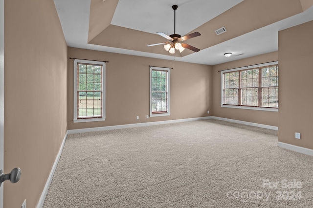 spare room with light colored carpet and ceiling fan