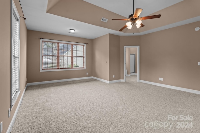 unfurnished bedroom featuring ceiling fan and light carpet