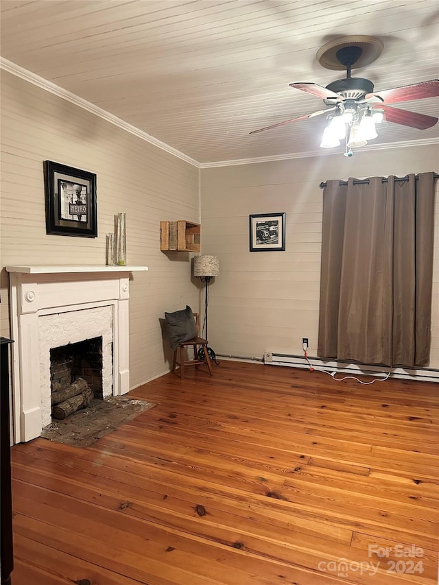 unfurnished living room featuring hardwood / wood-style flooring, ceiling fan, and ornamental molding