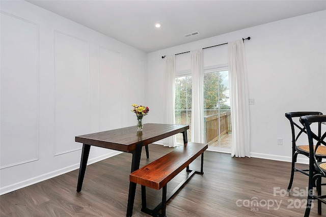 dining area featuring dark hardwood / wood-style floors