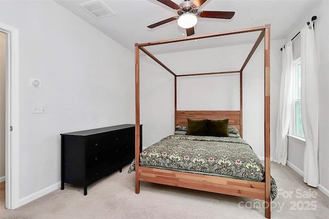 bedroom featuring ceiling fan and carpet