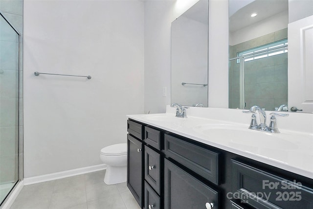 bathroom featuring a shower with door, vanity, tile patterned flooring, and toilet