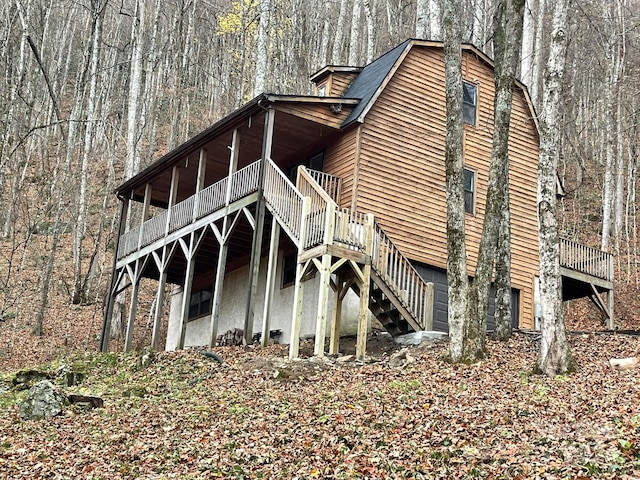 view of property exterior featuring a deck