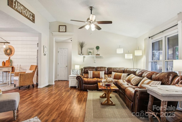 living room with vaulted ceiling, dark hardwood / wood-style floors, and ceiling fan