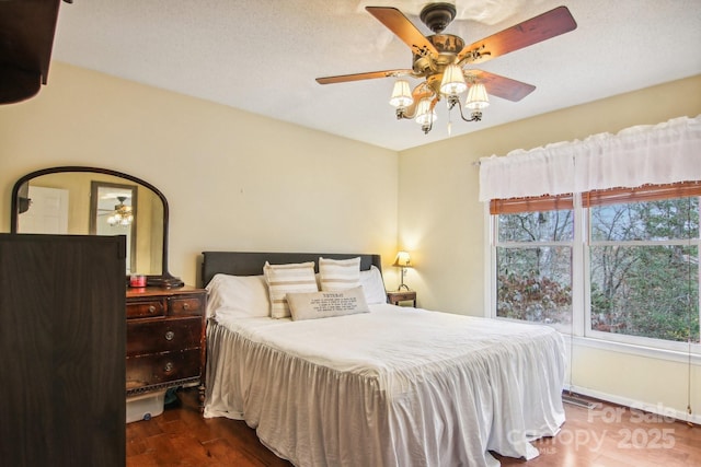 bedroom featuring dark hardwood / wood-style floors and ceiling fan