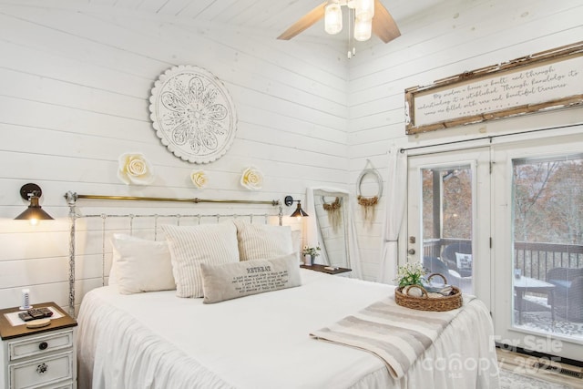 bedroom with access to exterior and ceiling fan