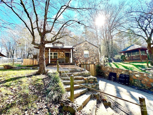 back of property with a gazebo