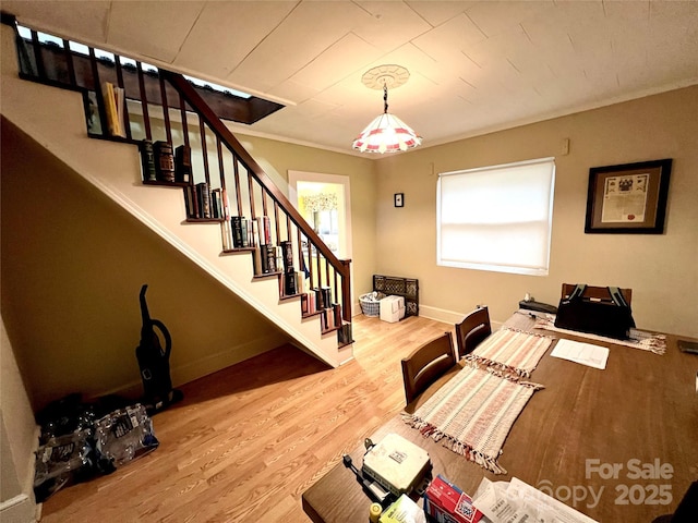 bedroom with wood-type flooring and crown molding