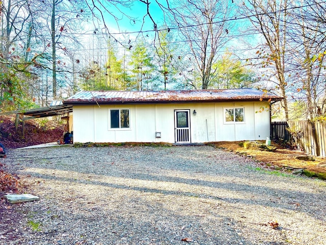 ranch-style house featuring a carport