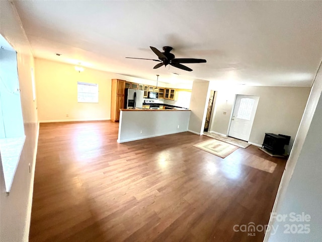 unfurnished living room with ceiling fan and light hardwood / wood-style floors