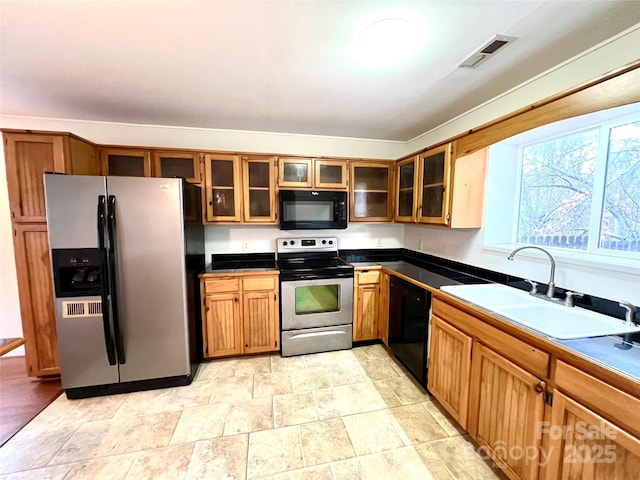 kitchen featuring sink and black appliances