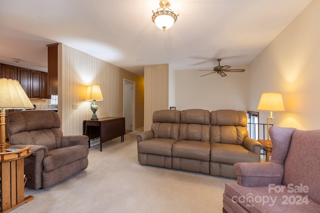 living room featuring light carpet and ceiling fan