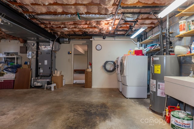 basement with water heater, heating unit, sink, and separate washer and dryer