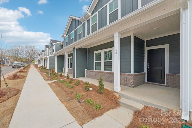 property entrance featuring a porch